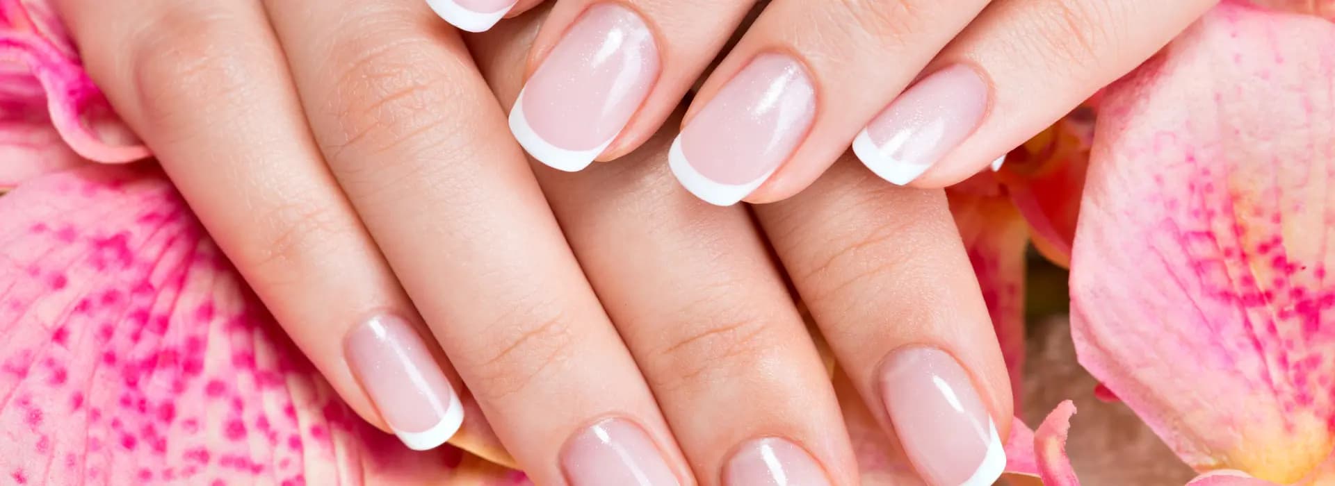 French tip manicure with pink orchid flowers